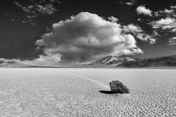 Why and How Photographing Racetrack Playa in Death Valley A sailing stone in the dry lake of Racetrack Playa in Death Valley in California.