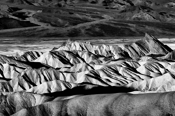 3 Steps for Reading and Appreciating a Photograph Black and white landscape photograph of Zabriskie Point in Death Valley, United States.